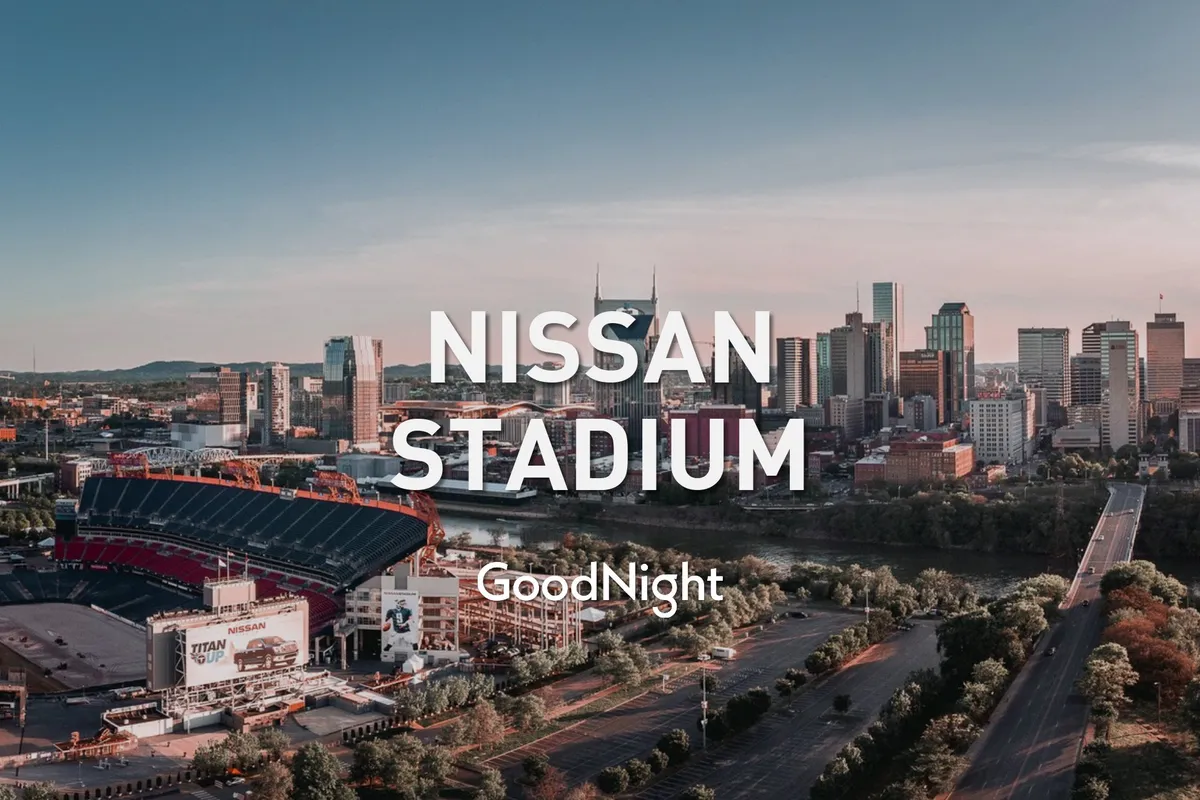 A sweeping exterior shot featuring Nissan Stadium prominently set against the dramatic Nashville skyline, with the river in the foreground. The city appears vibrant and alive, hinting at major events and business opportunities nearby.